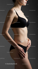 Elegant Woman in Black Lingerie Showing Confident Pose in Studio