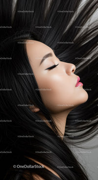 Elegant woman with flowing black hair and closed eyes