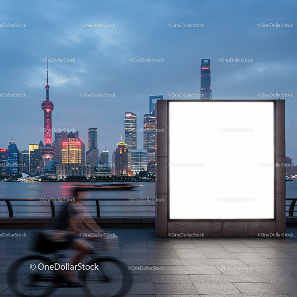 Urban cyclist passing illuminated billboard by river JPG Mockup Image