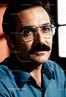 Middle-aged man with glasses and mustache in natural light