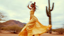 Dancing Woman in Yellow Dress Against a Desert Landscape