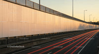 Light Trails on Modern Urban Highway at Sunset