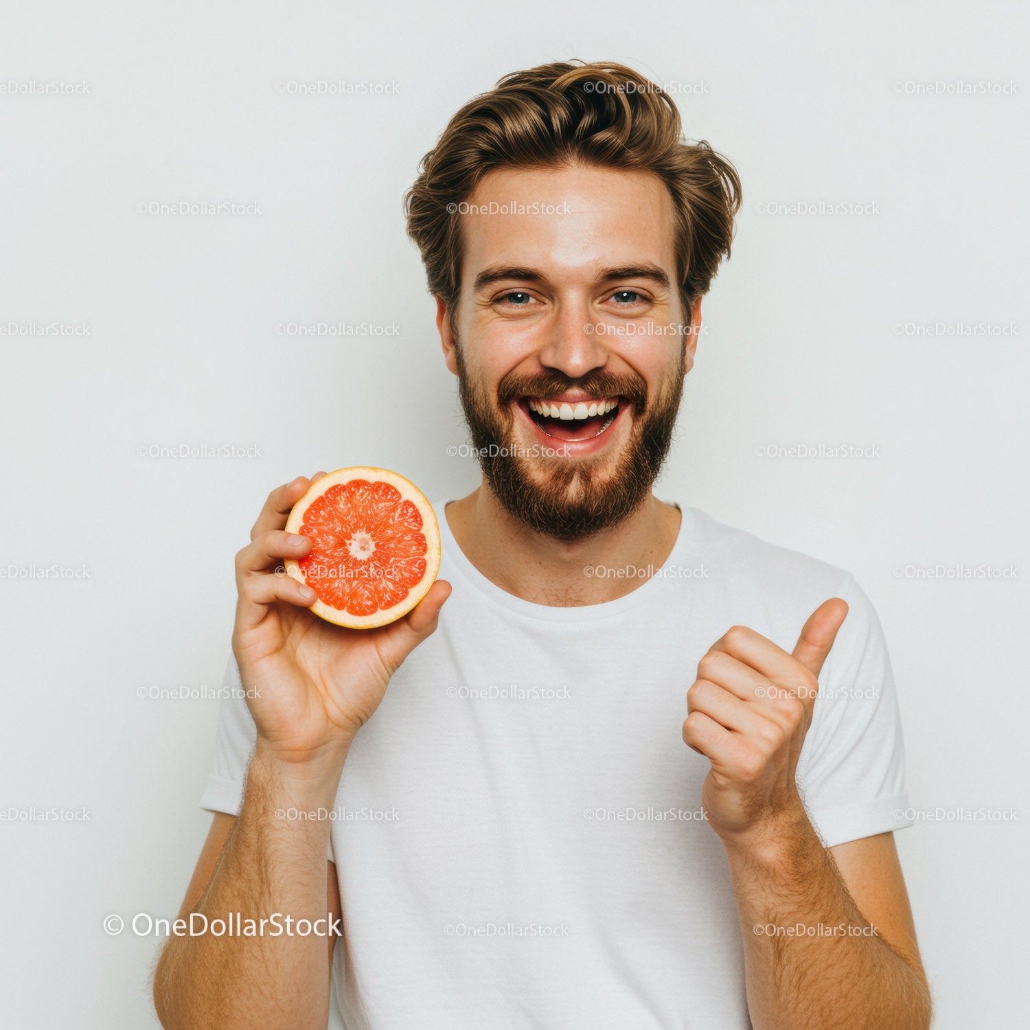 Joyful Man with Bright Red Grapefruit for Healthy Lifestyle Promotion