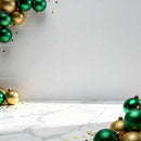 Festive Green and Gold Christmas Ornaments on Marble