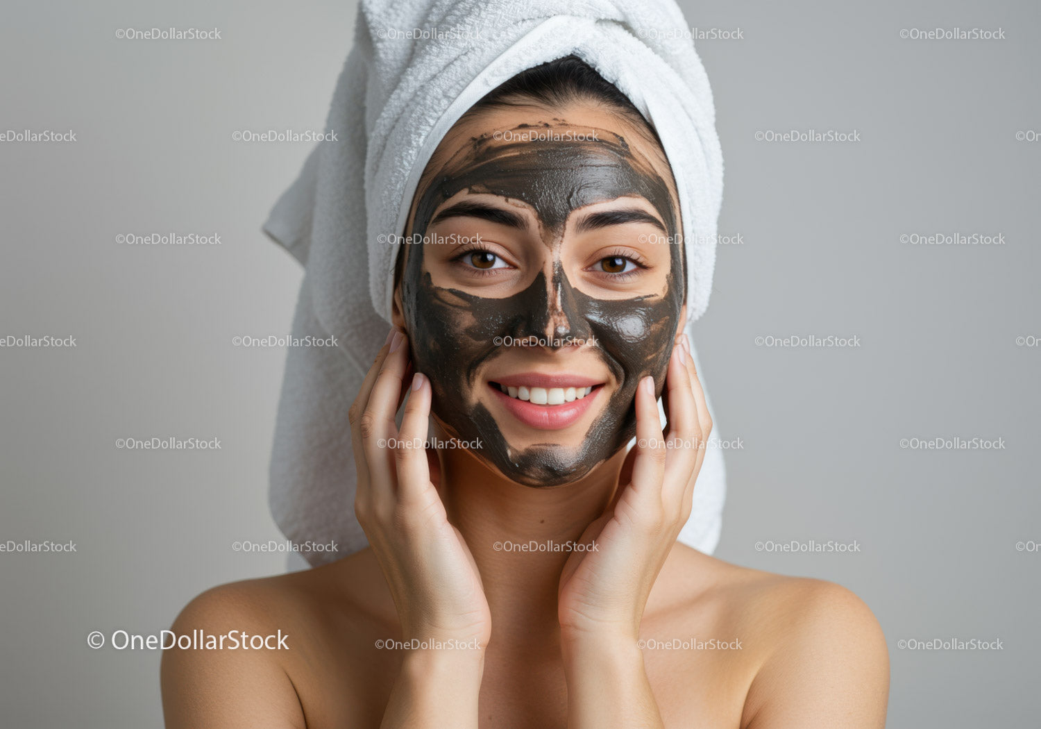 Woman with Black Mud Facial Mask Relaxing at Spa for Skin Rejuvenation
