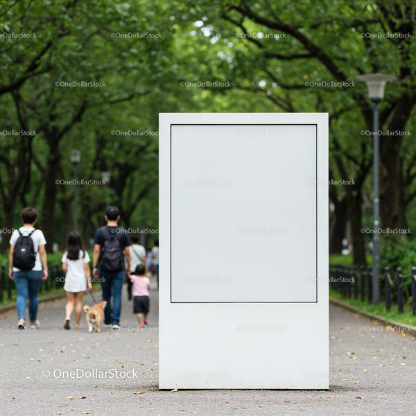 Blank white billboard in green park with walking family JPG Mockup Image