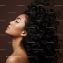 Profile of serene woman with flowing curly hair