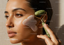 Young Woman Using Jade Roller for Facial Skin Rejuvenation and Wellness