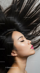 Profile of woman with flowing black hair and vibrant lips