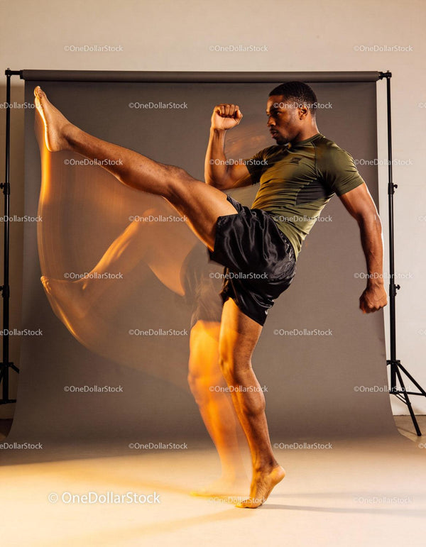 Athlete Performing High Kick in Studio Lighting