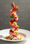 Elegant strawberry dessert with cream and basil garnish
