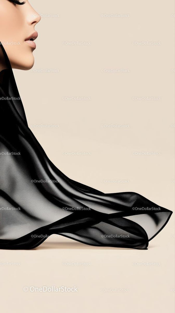 Elegant Close-Up of Woman's Lips with Black Silk Fabric in Minimalist Setting