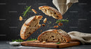 Rustic bread breaking apart with fresh rosemary herb