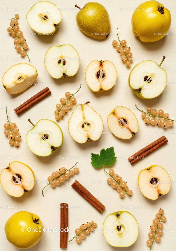 Fresh quince and pear halves with cinnamon and berries