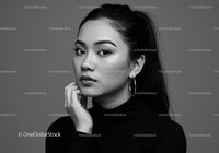 Elegant Black and White Portrait of a Stylish Young Woman