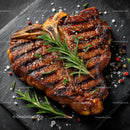 Delicious Grilled Steak on Slate with Fresh Rosemary Garnish