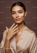 Elegant Woman Applying Moisturizer With Flawless Skin