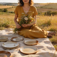 Woman in Mustard Dress Holding Wildflower Bouquet Outdoors