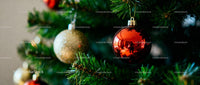 Close-up of Christmas tree with shiny baubles