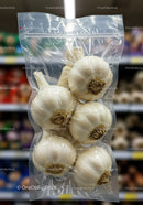Vacuum Packed Fresh Garlic Bulbs on Shelf
