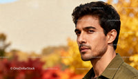 Thoughtful young man outdoors in autumn colors