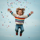 Joyful child jumping with colorful confetti around