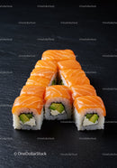 Fresh Salmon Avocado Sushi Rolls on Black Slate