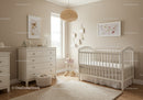 Bright nursery with white crib and cozy decor for babies