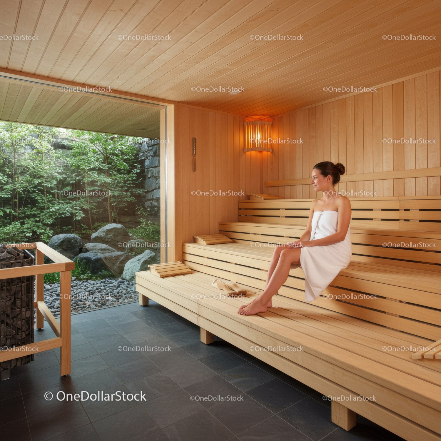 Relaxing Woman Sitting on Wooden Bench in Cozy Sauna Interior
