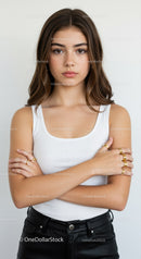 Portrait of a Confident Young Woman in Casual White Top and Black Leather Pants