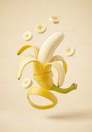 Floating peeled banana with sliced pieces in beige background