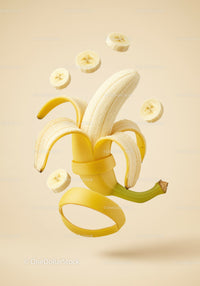 Floating peeled banana with sliced pieces in beige background