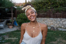 Joyful Woman Wearing Summer Casual Outfit with Gold Jewelry Outdoors