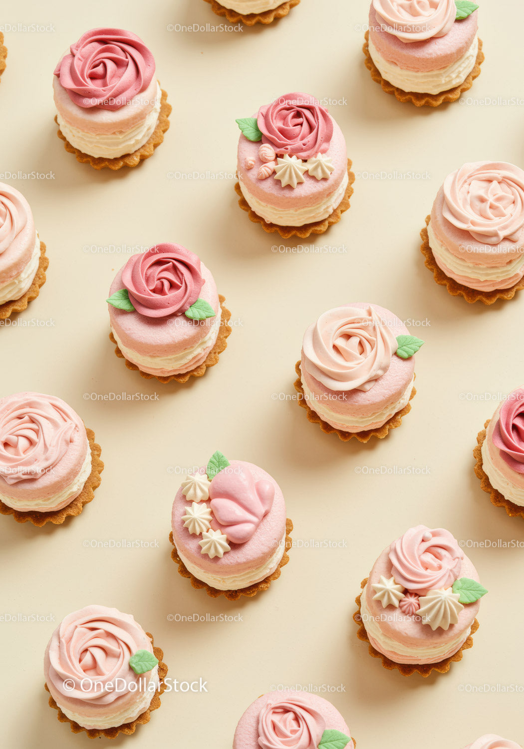 Mini Pink Rose Cupcakes with Cream and Decorative Leaves
