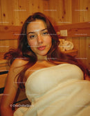 Young Woman Relaxing Indoors with Warm Wooden Decor