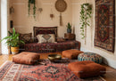 Cozy Bohemian Living Room with Vintage Textiles and Plants