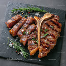 Gourmet Grilled Lamb Rack with Herbs on Slate Serving Board