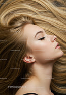 Profile of serene woman with flowing blonde hair