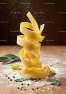 Twisted fresh pasta ribbon with spices and flour dust