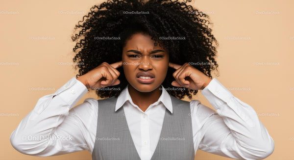 Frustrated Women Covering Ears Expressing Displeasure