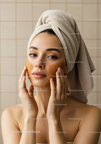 Woman Applying Facial Mask in Spa Setting for Relaxation and Skin Care