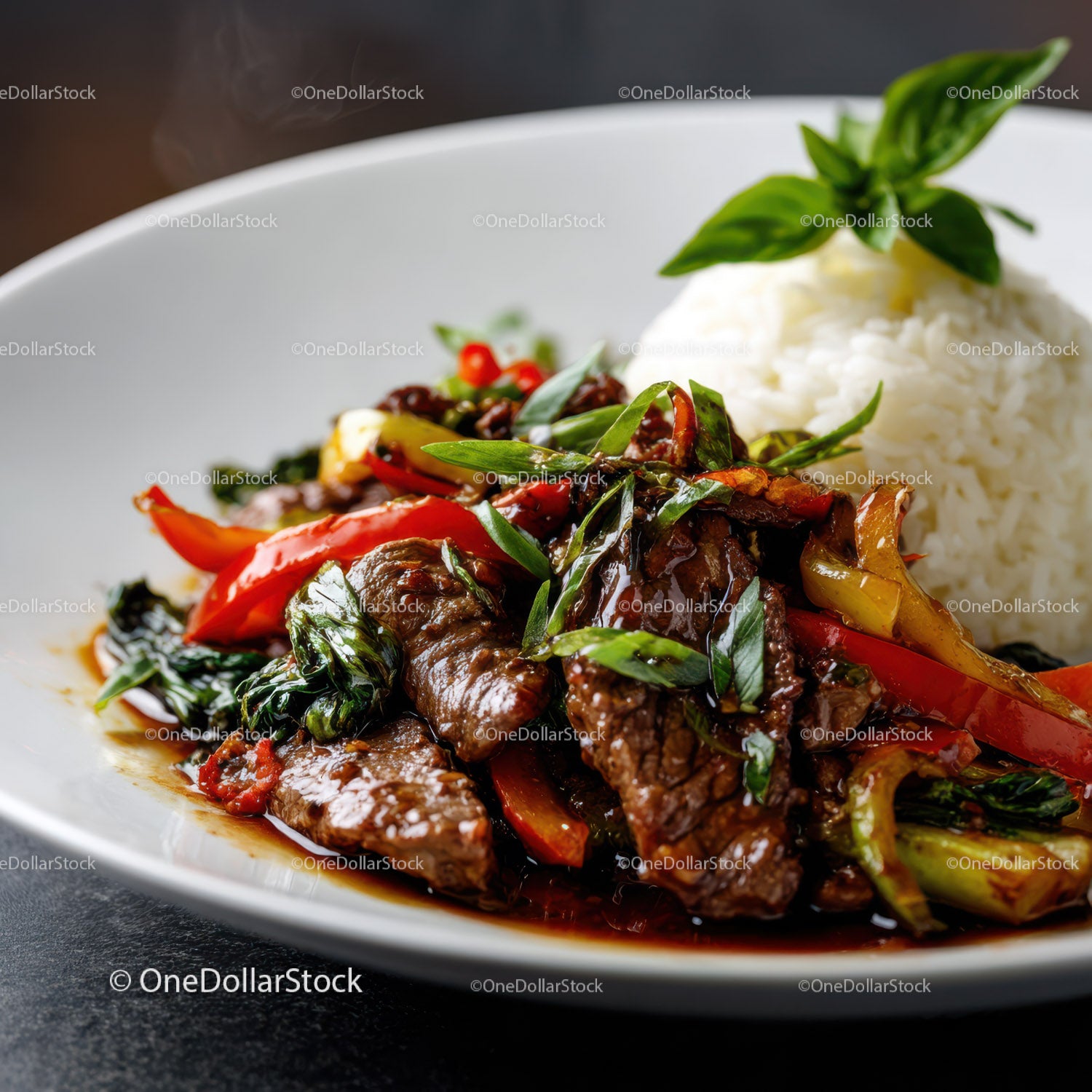 Stir-Fried Beef with Bell Peppers and Basil Served with Rice