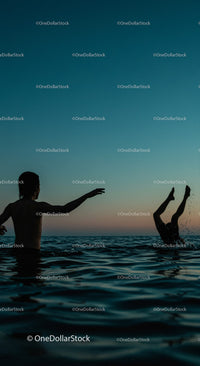 Playful Moments in the Water at Sunset