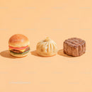 Gourmet Burger with Lettuce and Tomato Next to Grilled Steak and Dumpling