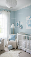 Bright Baby Nursery with White Crib and Soft Decor in Light Blue