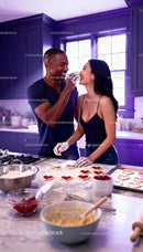 Couple Enjoying Baking Heart-Shaped Cookies Together