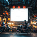 Evening street scene with scooters near market stalls