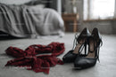 Chic Black Heels and a Red Lace Dress in a Cozy Bedroom Setting