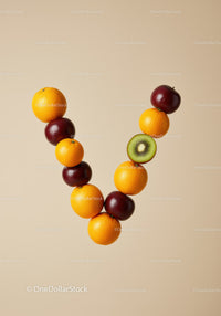 Balanced V-shaped arrangement of fresh colorful fruits