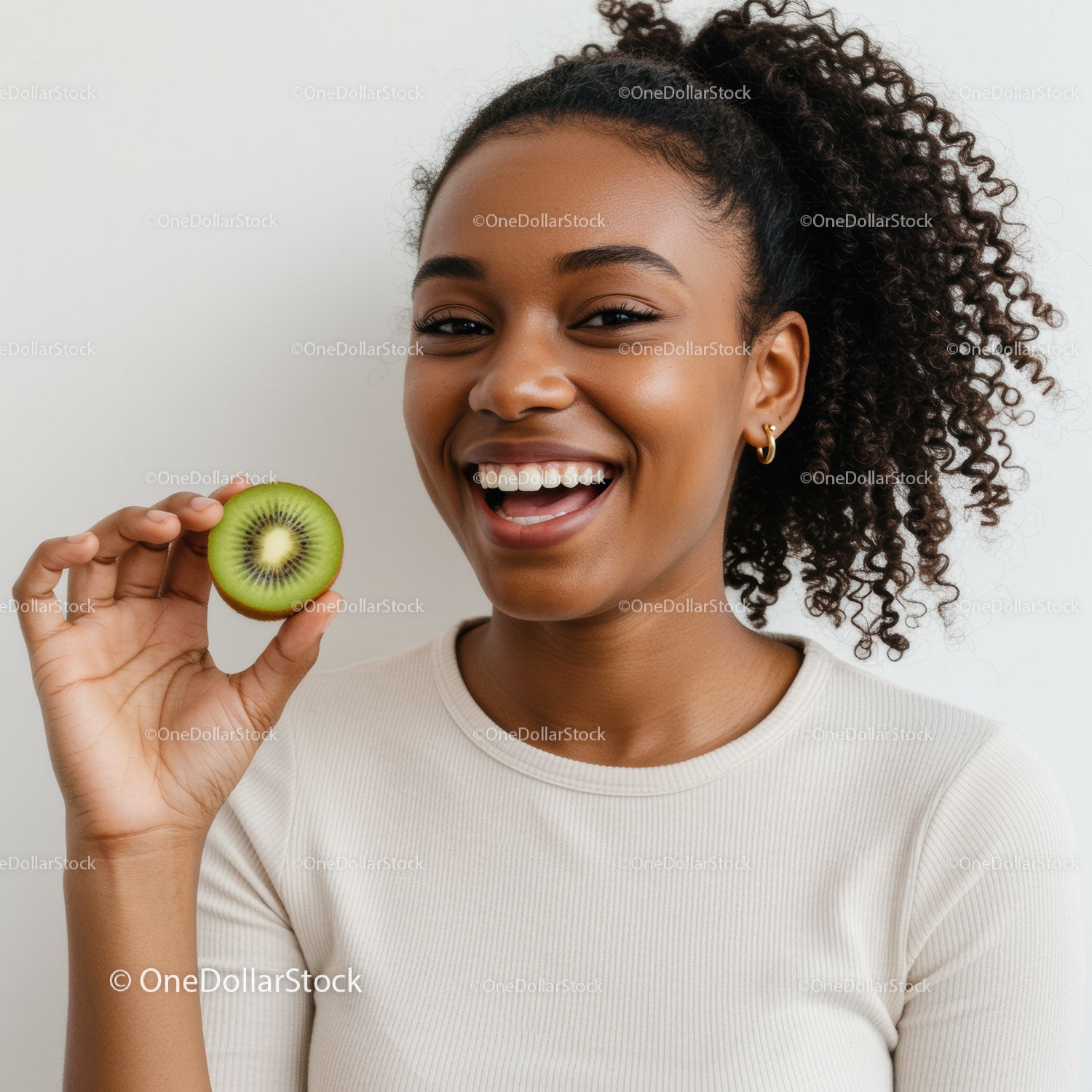 Young Woman Smiling with Fresh Kiwi Fruit for Healthy Lifestyle